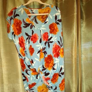 Women's casual blouse with knotted front at bottom colors are blue brown orange